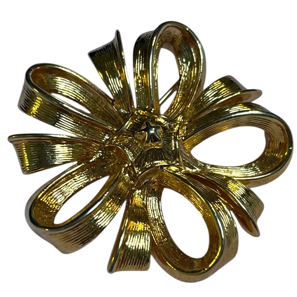 Monet  Gold-tone metal with a textured, horizontal brushed pattern